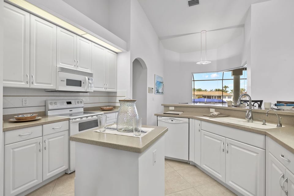 The kitchen setup is complete with an island