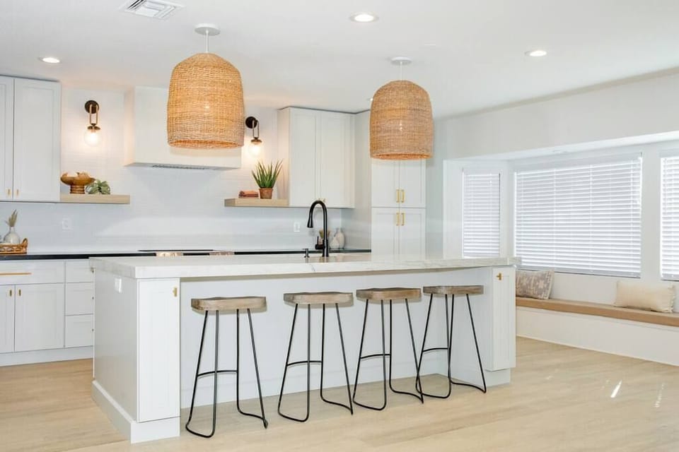 Modern kitchen with a large island and natural woven pendant lighting