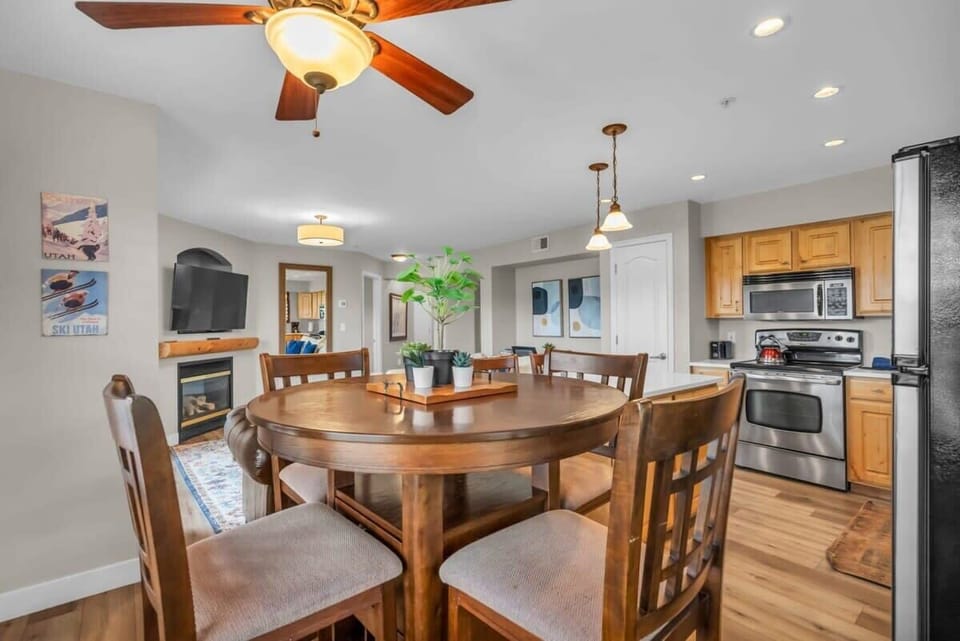 A round table with four chairs situated just off the kitchen is the perfect dining nook to enjoy meals and snacks while still keeping connected with your group.