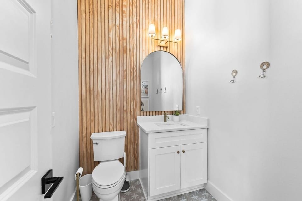 Bathroom #8 is a half bath, easily accessible from the pool area.