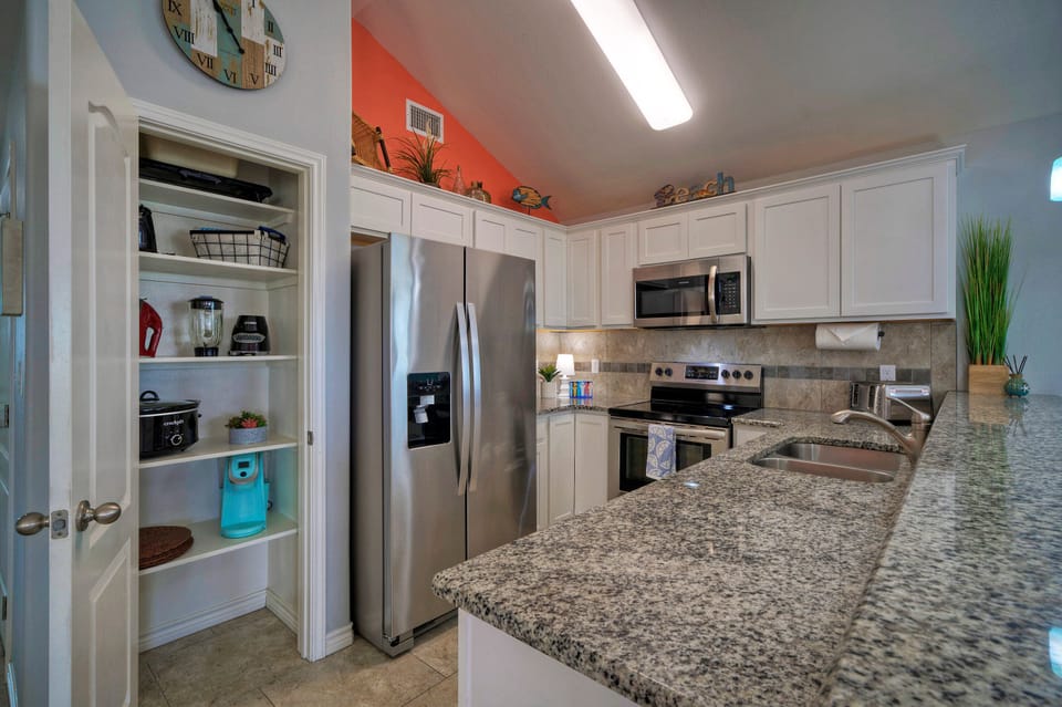Fully-equipped kitchen with modern appliances.