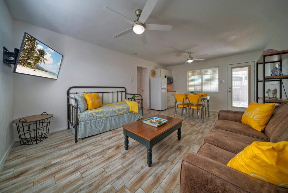 Recreation room features a day bed with couch.