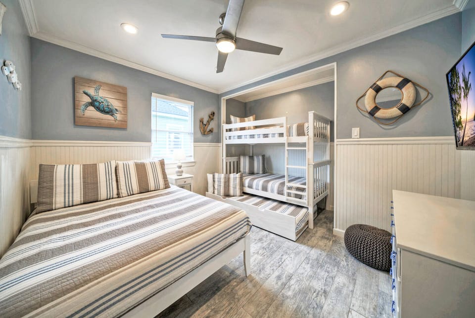 Bedroom 3 features a queen bed and a twin over-twin bed with a trundle.