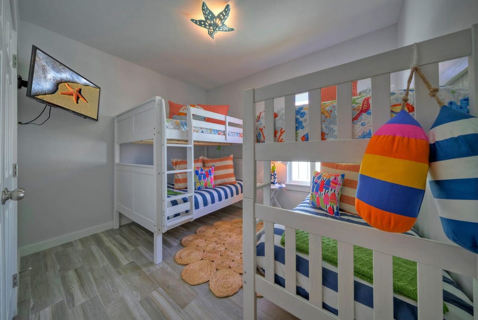 Bedroom 3 features a Full over full and twin over twin bunk beds.