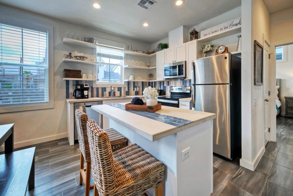 Additional barstool seating at the kitchen island.