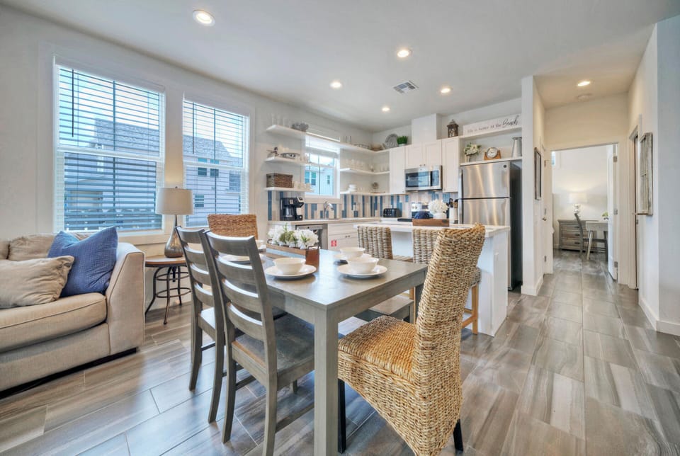 Dining table features four chairs and bench seating.