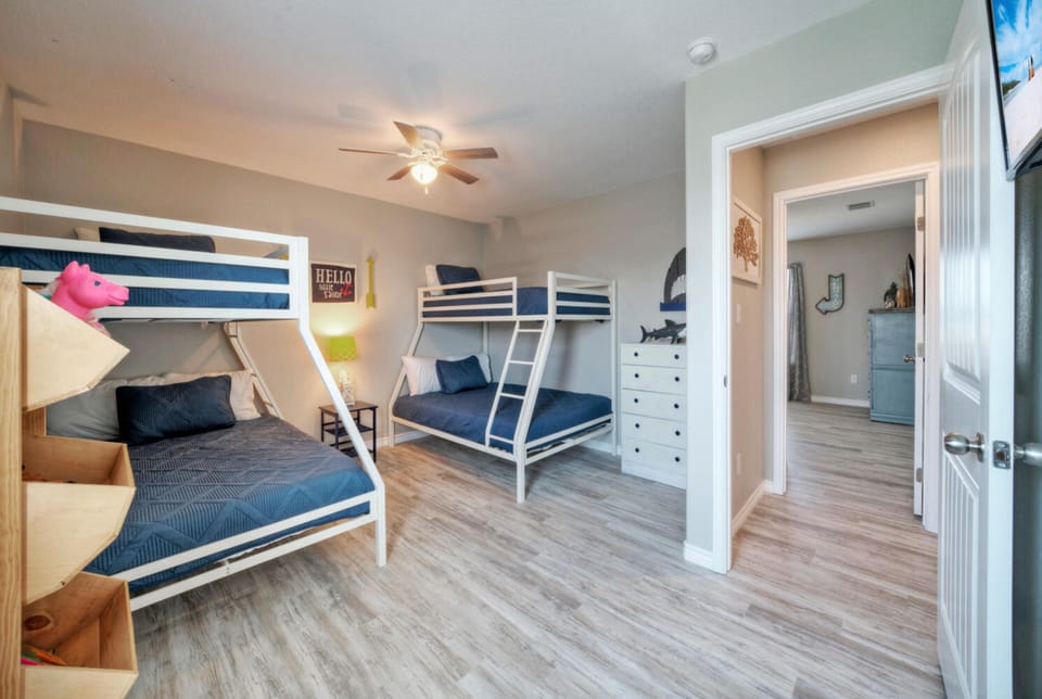 Bedroom 4 features Double and single bunk beds.
