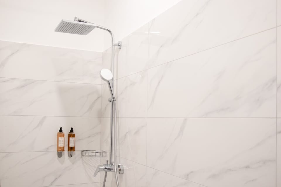 Shower, rainfall showerhead, eco-friendly toiletries, hair dryer