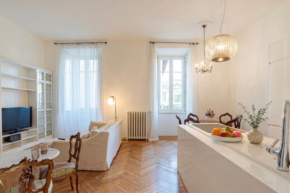 Family Apartment, Multiple Bedrooms (Appartamento Reggenza) | Living area | 21-inch flat-screen TV with digital channels, TV