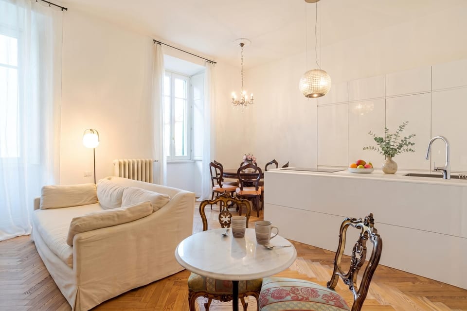 Family Apartment, Multiple Bedrooms (Appartamento Reggenza) | Living area | 21-inch flat-screen TV with digital channels, TV