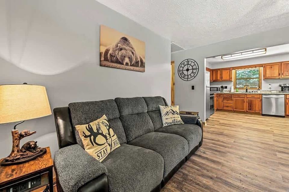 Kick back on the plush recliner and enjoy rustic cabin charm with a view into the kitchen.