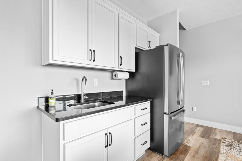 Need more space for drinks and snacks? The downstairs wet bar and extra fridge have you covered