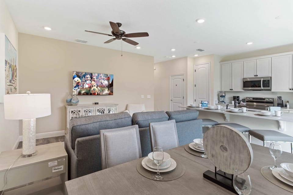 Sleek dining area of the cottage in Kissimmee Florida - Every meal becomes a celebration of togetherness - Chic design and comfortable - Seamless connection to kitchen and living area