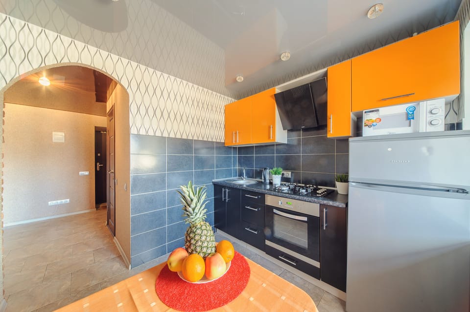 Classic Apartment | Private kitchen | Full-size fridge, microwave, oven, stovetop