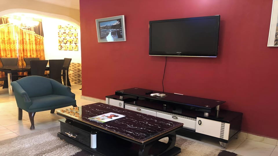 Luxury Apartment | Living area | 36-inch Smart TV with cable channels