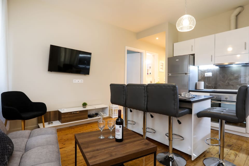 City Apartment | Living area | 42-inch LCD TV with cable channels