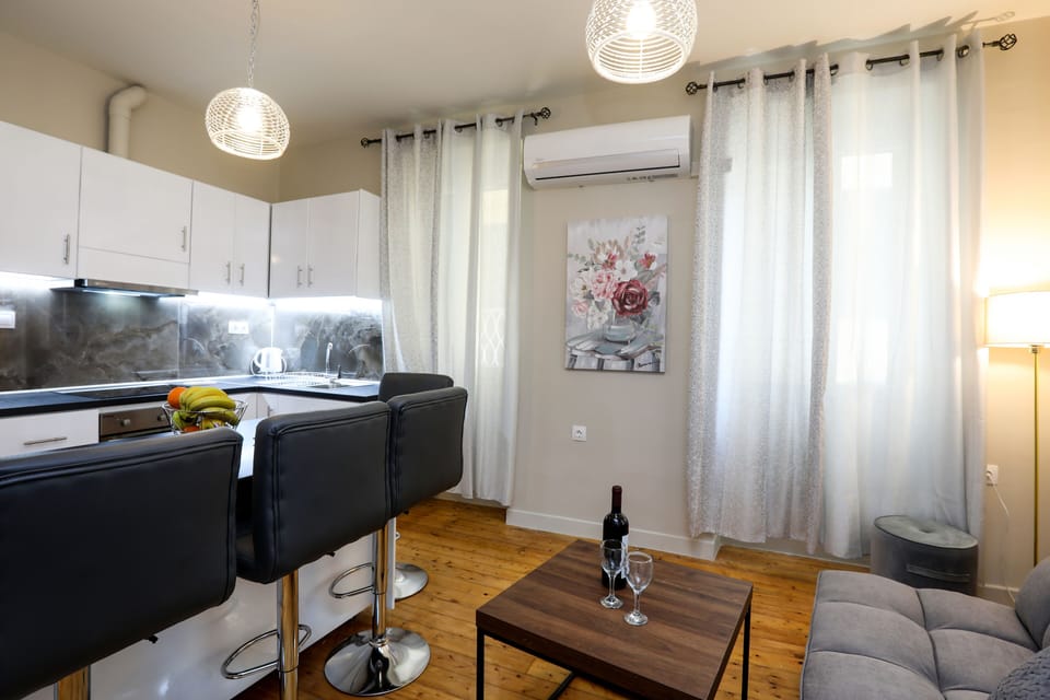 City Apartment | Living area | 42-inch LCD TV with cable channels