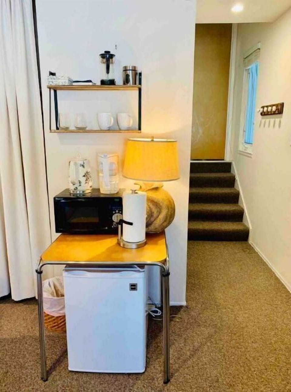 Mini fridge, microwave, electric water kettle, and coffee/tea