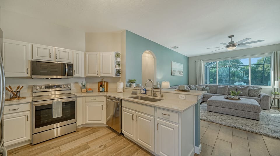 Open concept and fully stocked kitchen for easy family meals and group dining. 