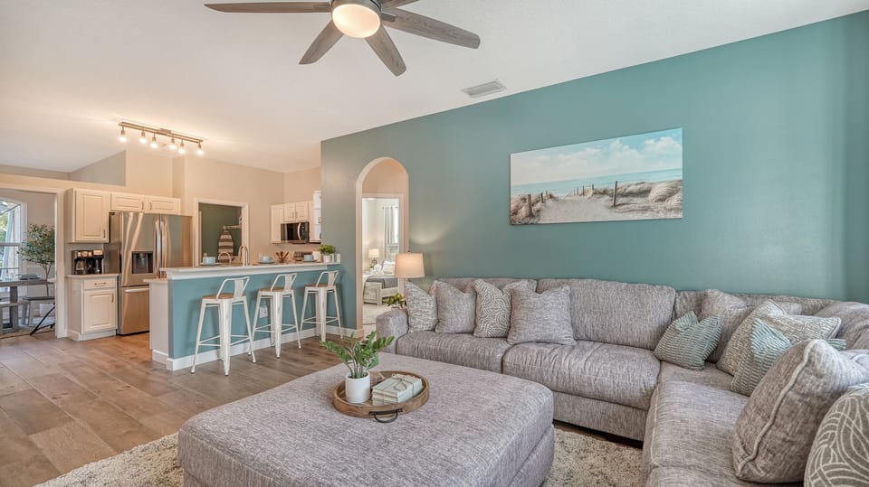 Relax on the huge sectional & oversized ottoman. A comfy space for everyone!