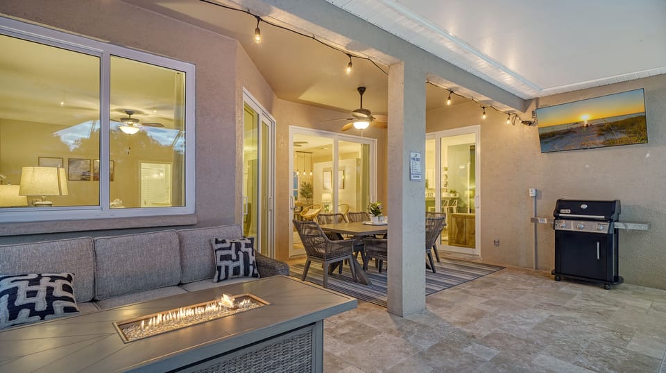 A private screened lanai with fire table for relaxing evenings under the stars.