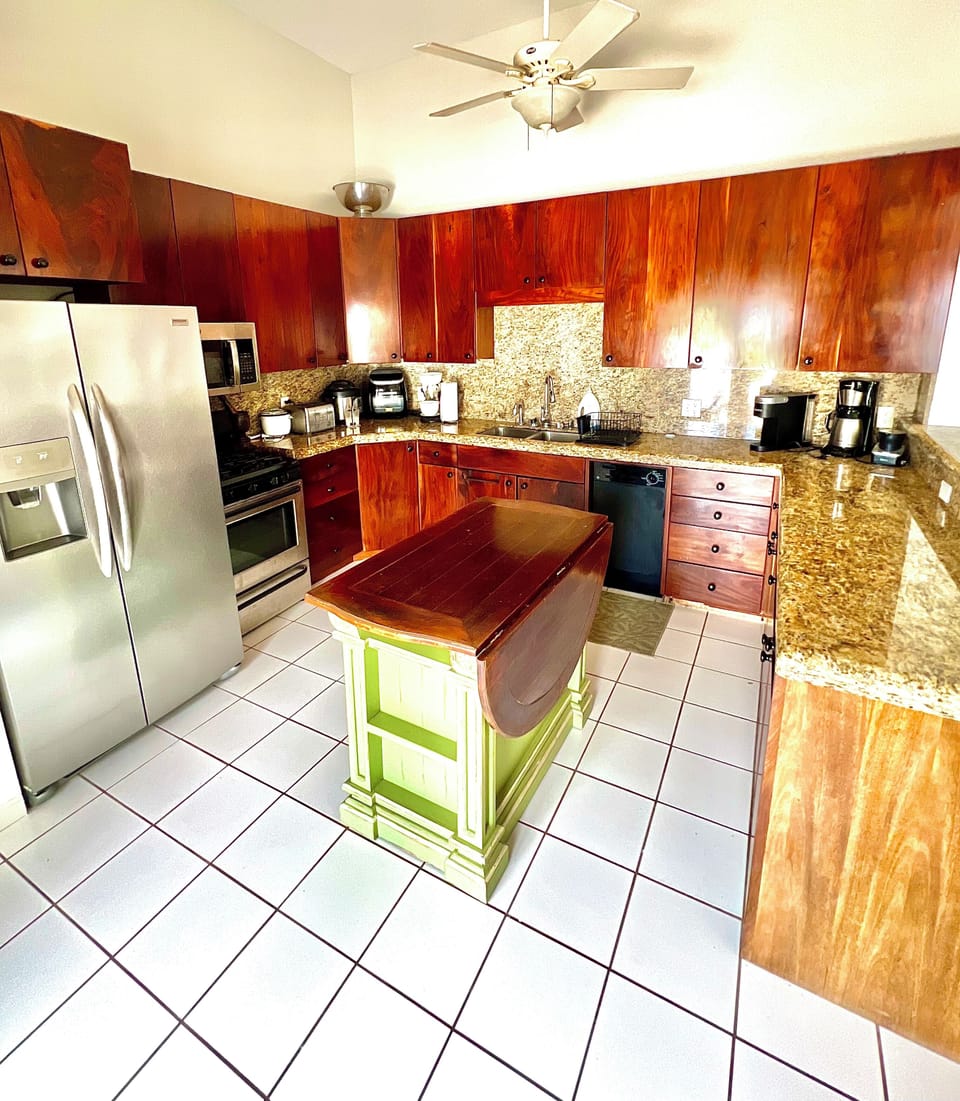 Kitchen 
Granite countertops, mahogany cabinets full of kitchen gadgets