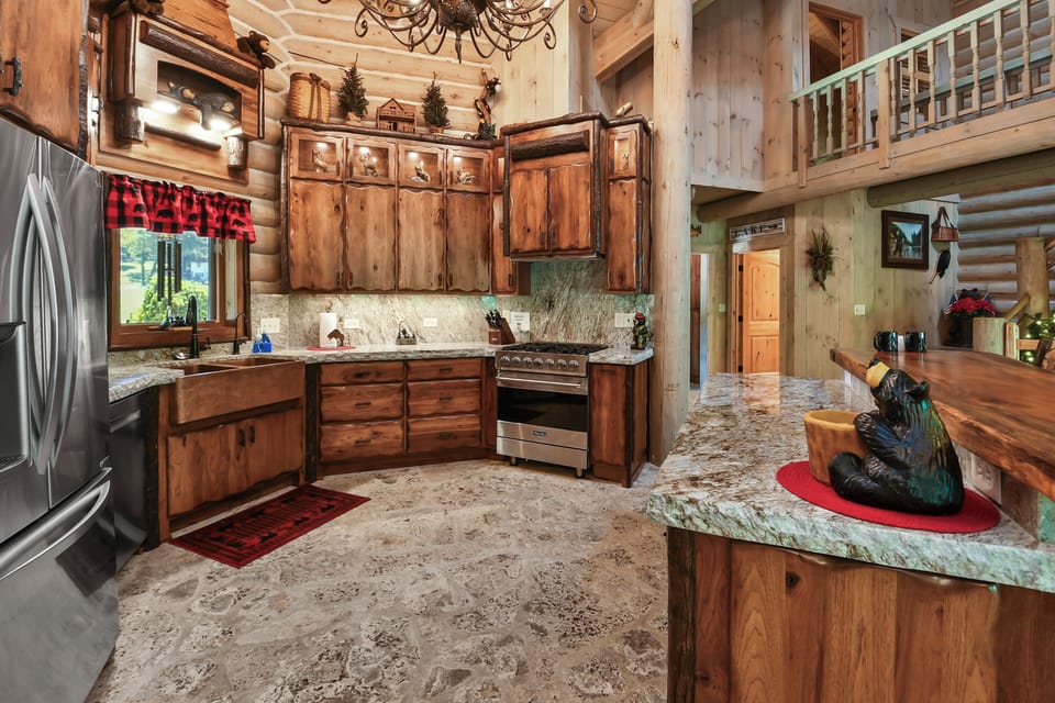Interact with family and friends while cooking in this stunning kitchen.