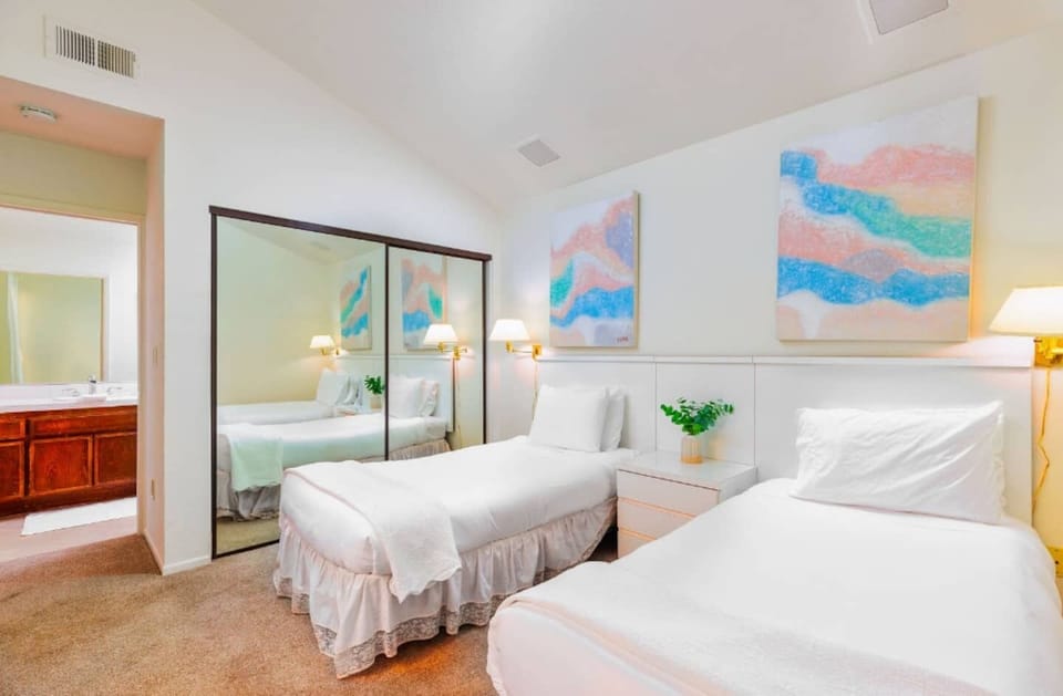 Guest bedroom #2 with 2 twin beds and an ensuite bathroom. 