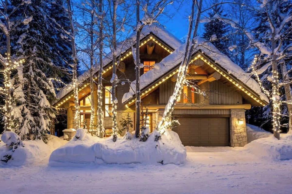 - Snow-covered chalet glowing with warm lights and holiday charm  
- Nestled among evergreens for a peaceful winter wonderland experience  
- Easy access to ski slopes and trails right from your doorstep  