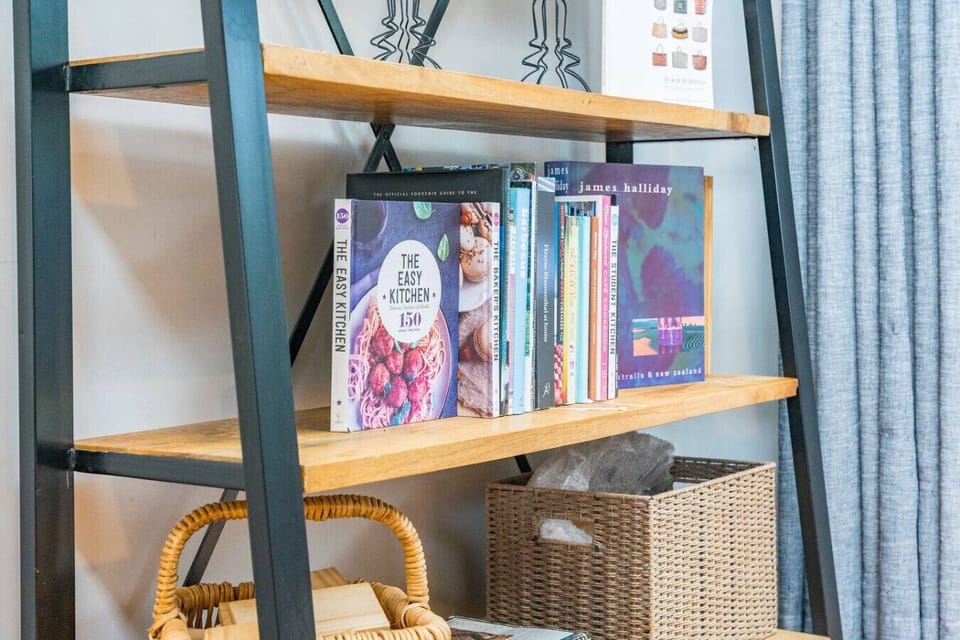 First floor book shelf next to dining area