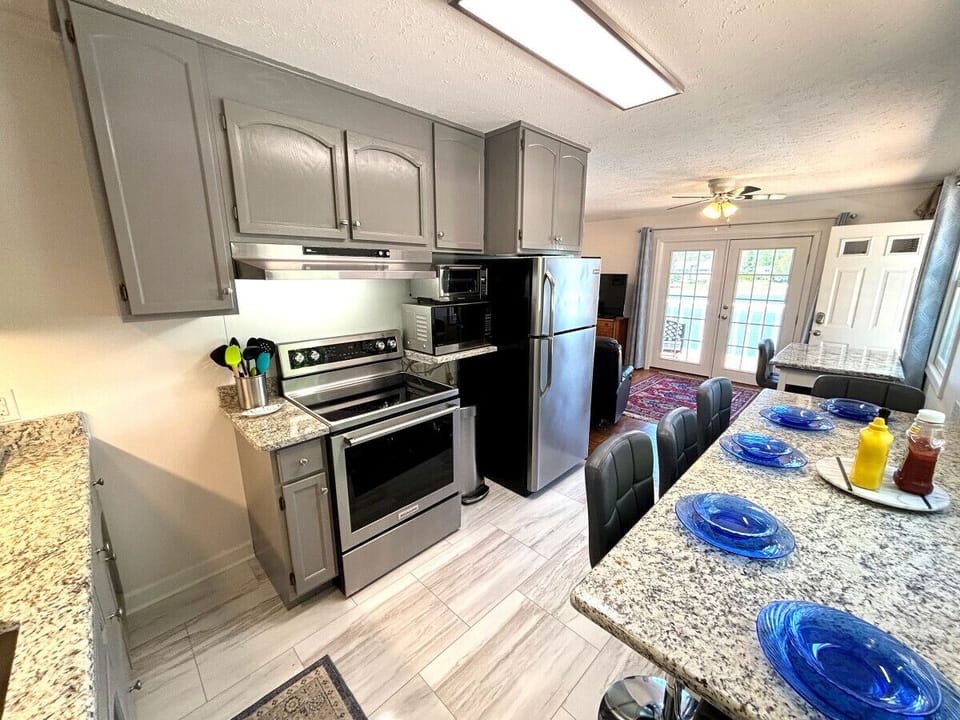 Kitchen with smart storage solutions in a charming, compact space.