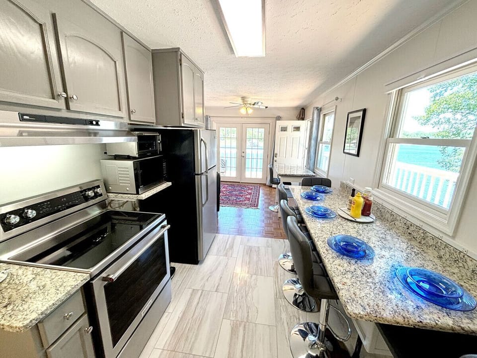Bright kitchen with essentials for home-cooked meals and gatherings.