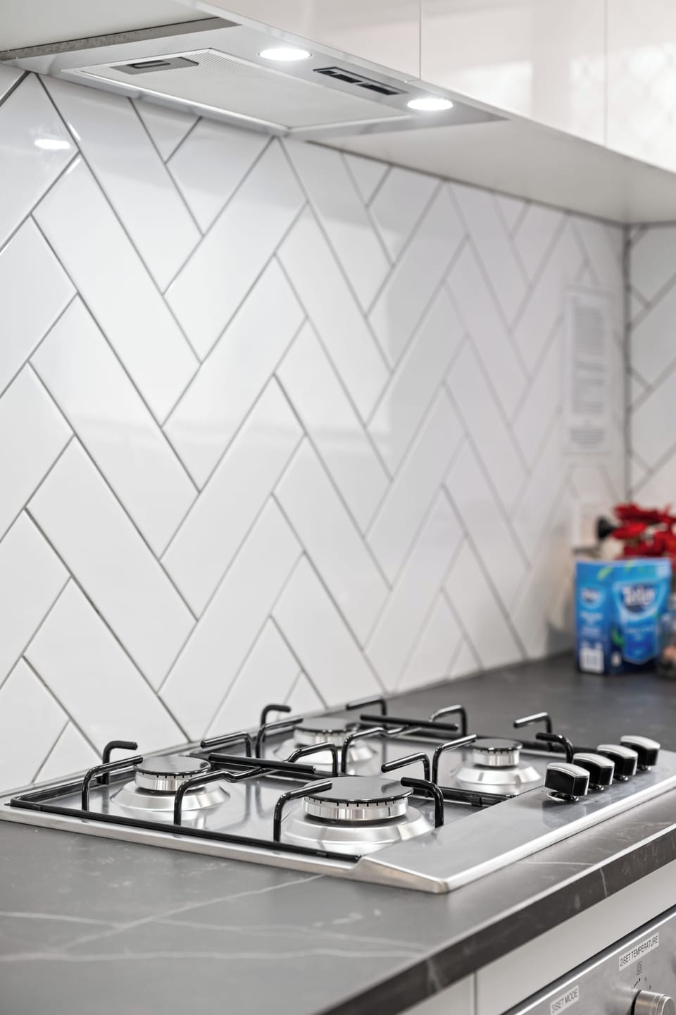 Kitchen with gas stove top.