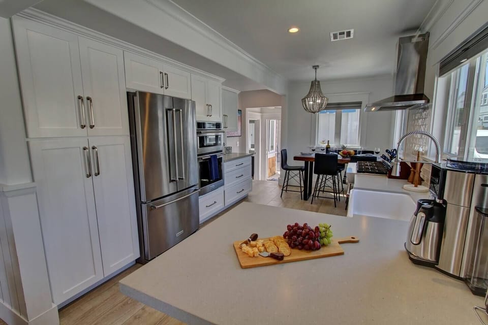 Modern kitchen with stainless steel appliances.