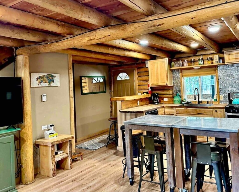 Open concept kitchen and back door that leads to patio, fire pit and hot tub.