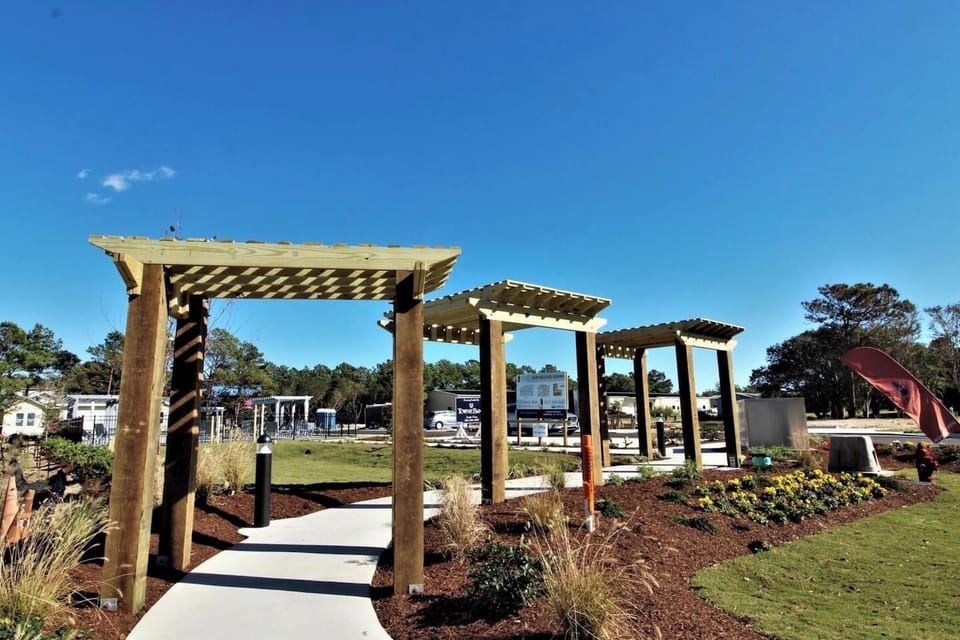 Beautiful community gathering spaces with pergolas and landscaped walkways.