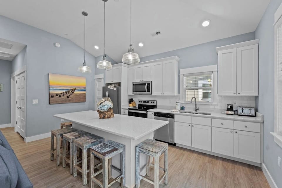 Stylish open-concept kitchen with plenty of space for cooking and entertaining.