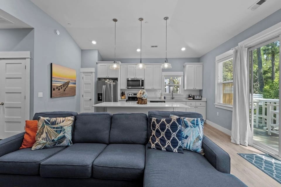 Another view of the bright open living and kitchen area with a welcoming layout.