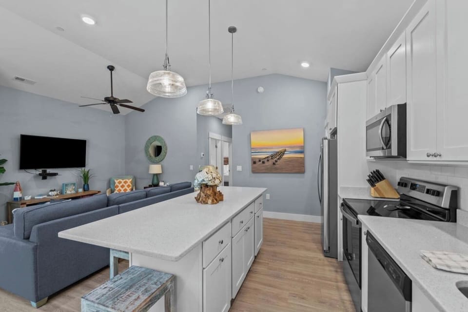 Bright kitchen with a large island, ideal for meals, coffee, or gathering together.