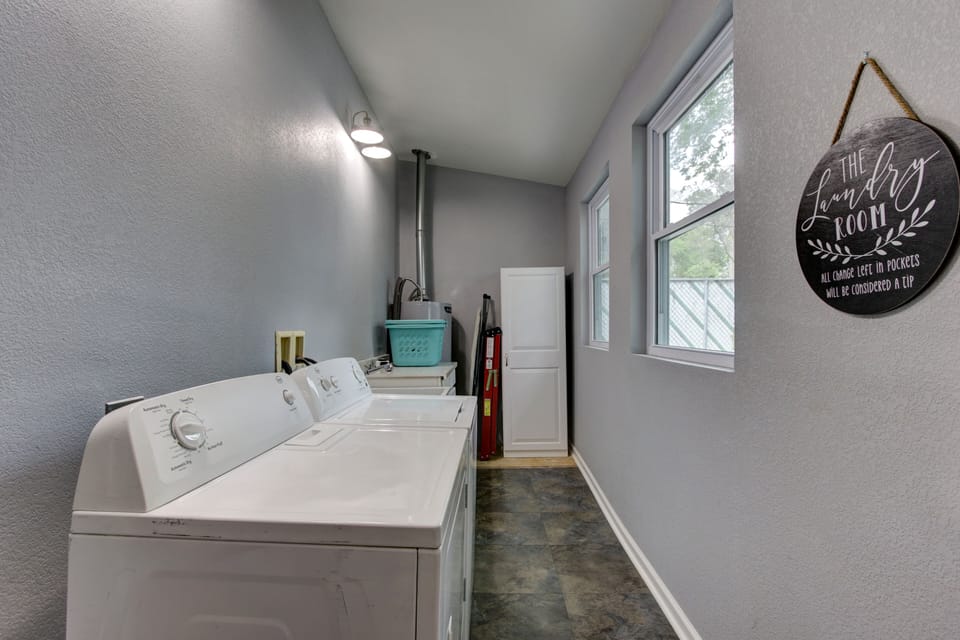 Laundry Room with full washer and dryer.