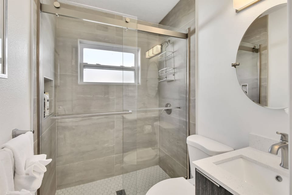 Step into the walk-in shower and rinse off the beach.