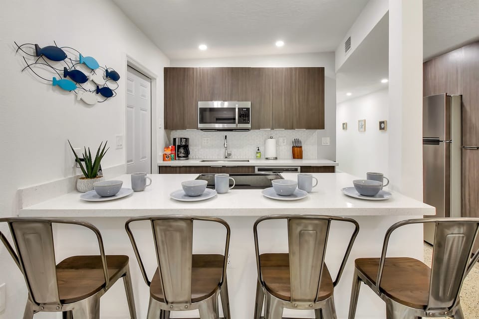 Kitchen is well stocked with all the pots, pans, utensils, dishes you need for cooking and baking as well as common staples and coffee