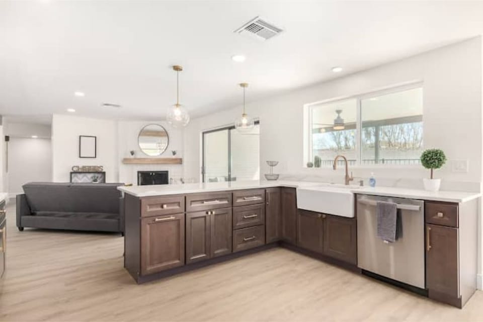 Calcatta quartz on espresso with champagne bronze and stainless finishes!