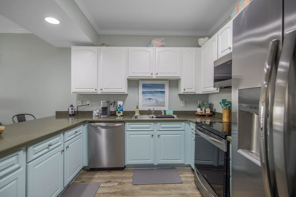 Kitchen has stainless steel appliances.