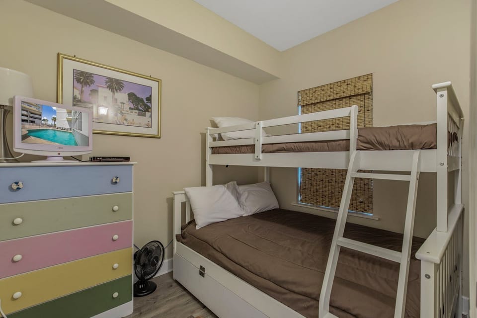 Bunk room with double-size bed on bottom and twin-size on top.