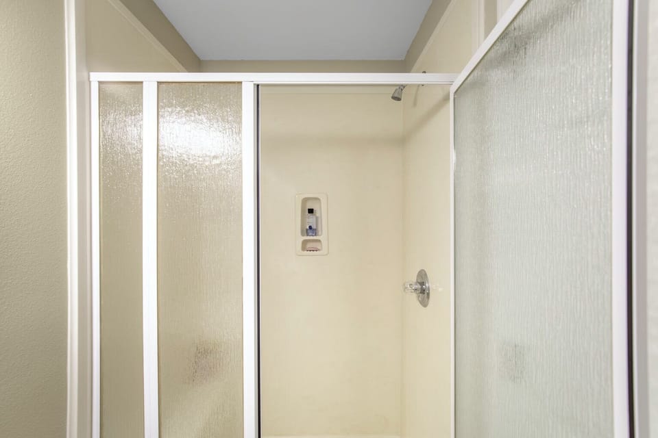 Main floor hallway bathroom with walk-in shower