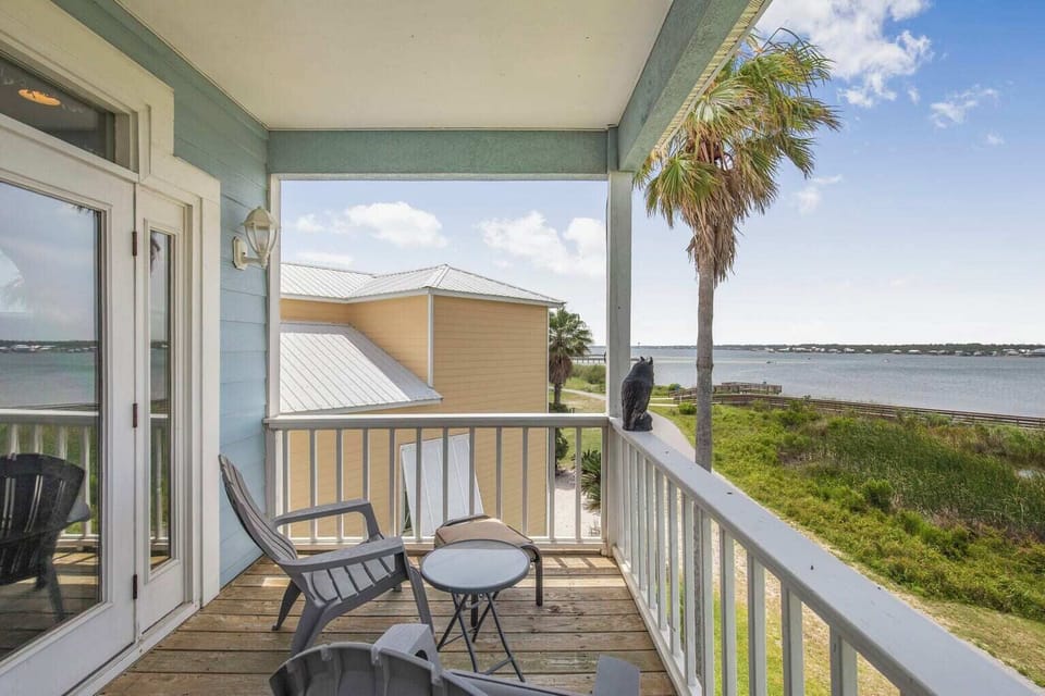 Balcony off the primary bedroom offers stunning sunset views