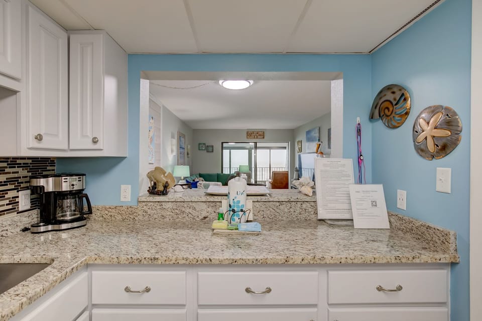 Kitchen is stocked with pots/pans/utensils.