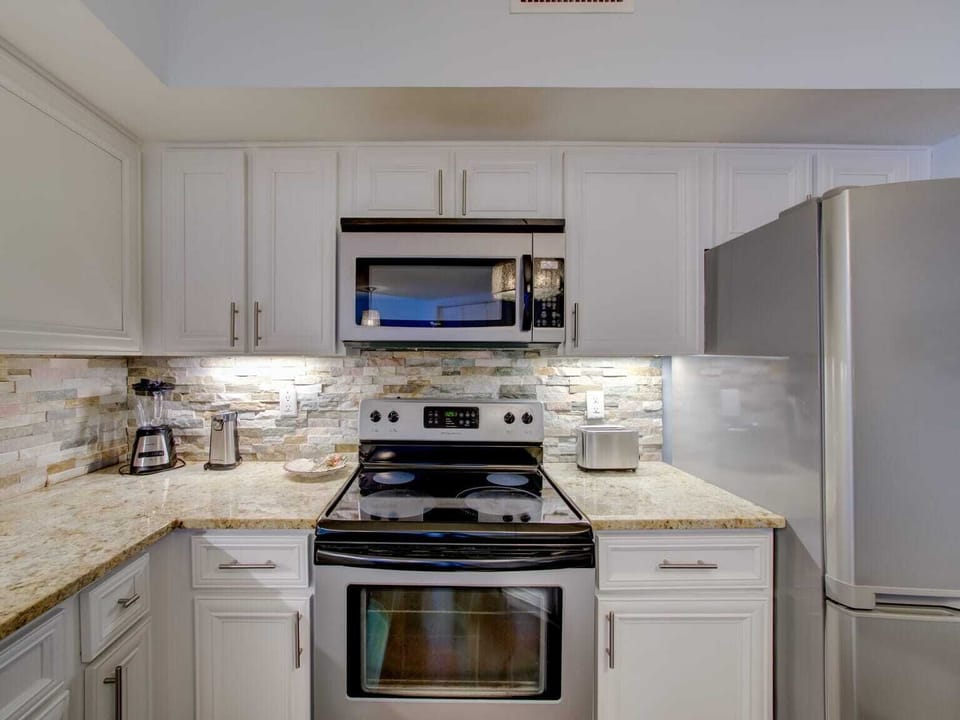 Beautiful kitchen with stainless steel appliances.