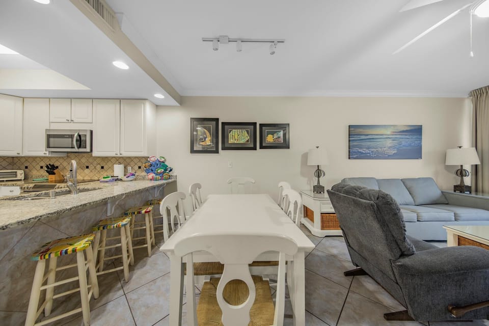 Dining table with seating for eight with additional seating at kitchen bar